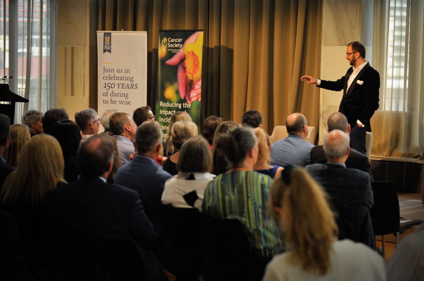 Chris Jackson addressing an audience at the Crossroads cancer conference
